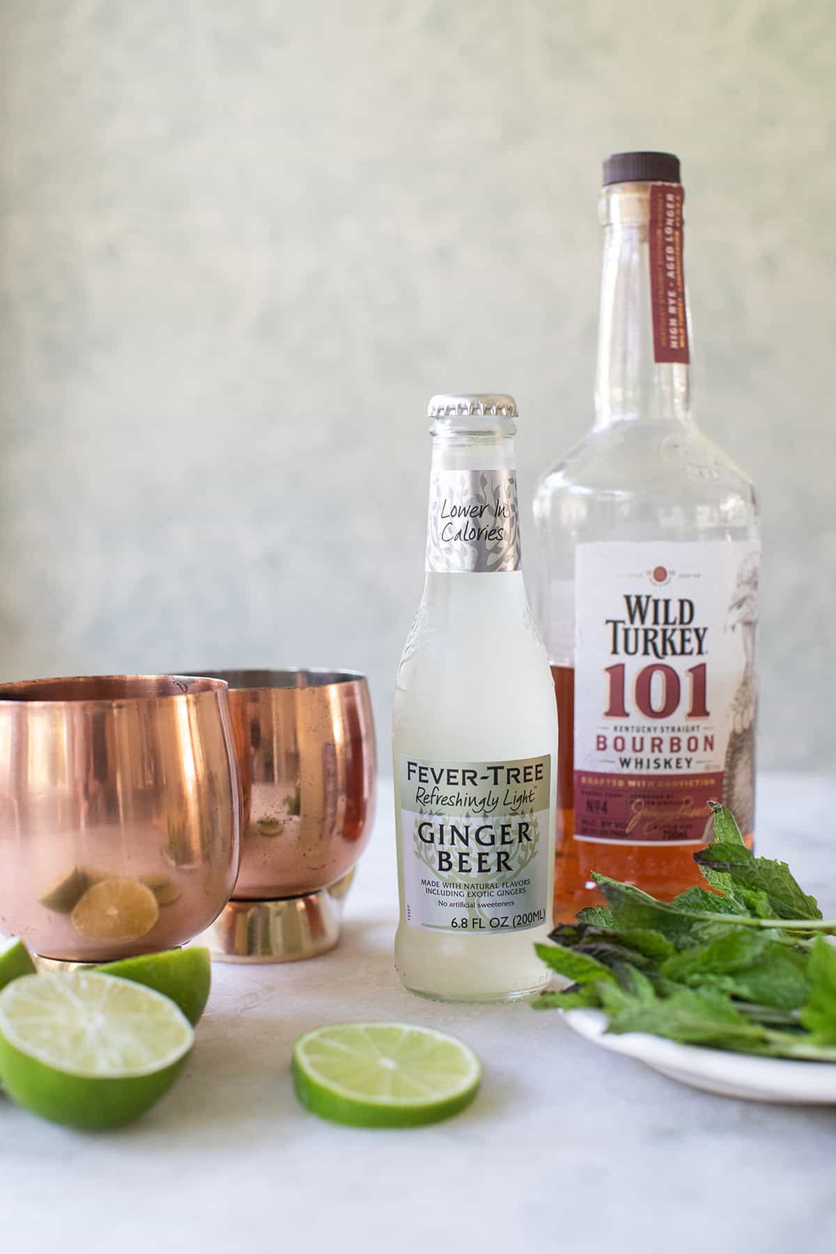 Bourbon, ginger beer, lime and copper mugs.