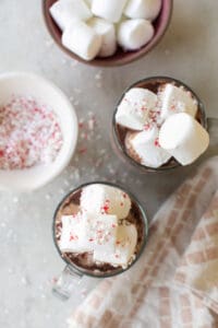 Peppermint hot chocolate with marshmallows and candy canes.