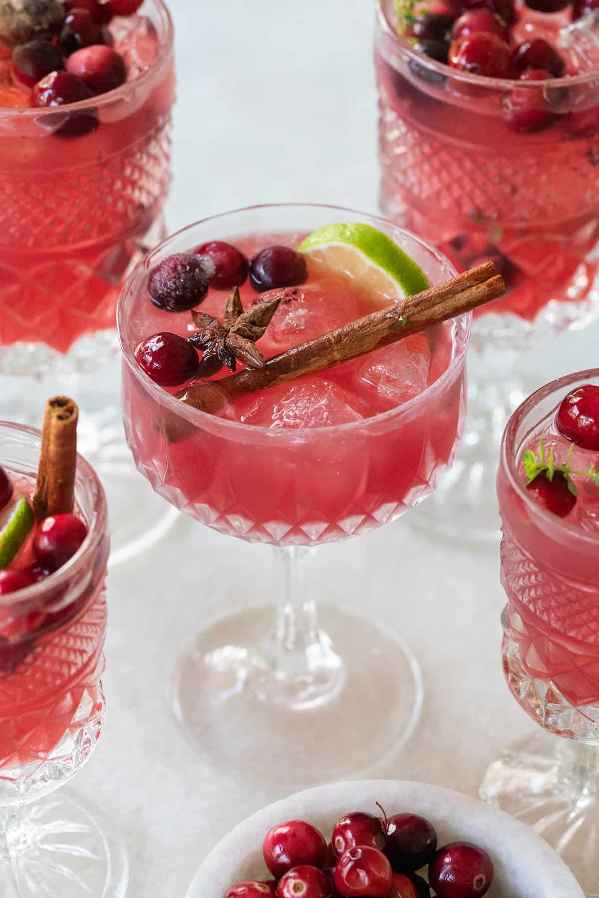 Holiday mocktail in a glass with cranberries.