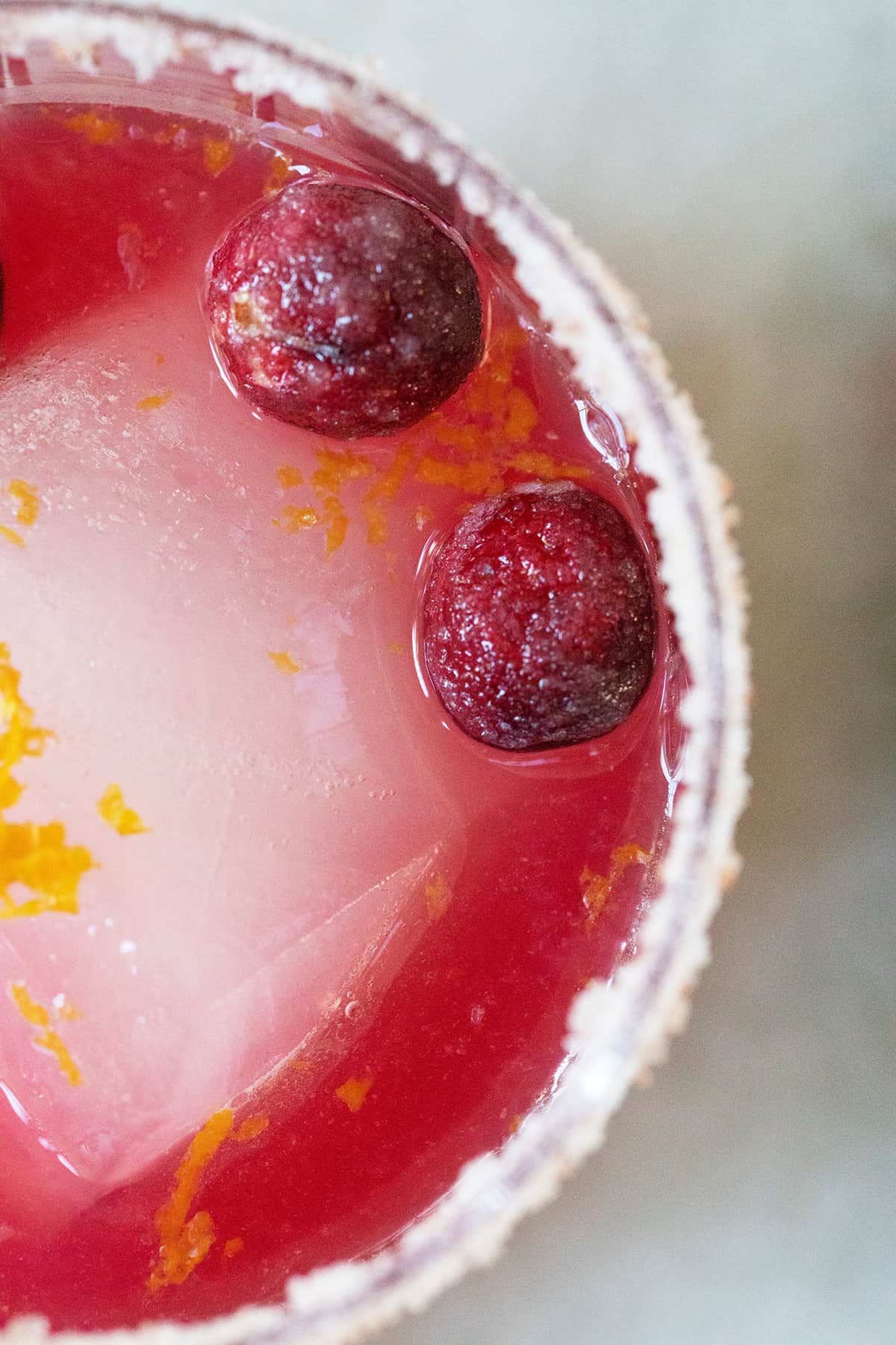 Festive pink drink with cranberries.