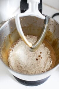 Adding flour to gingerbread mix.