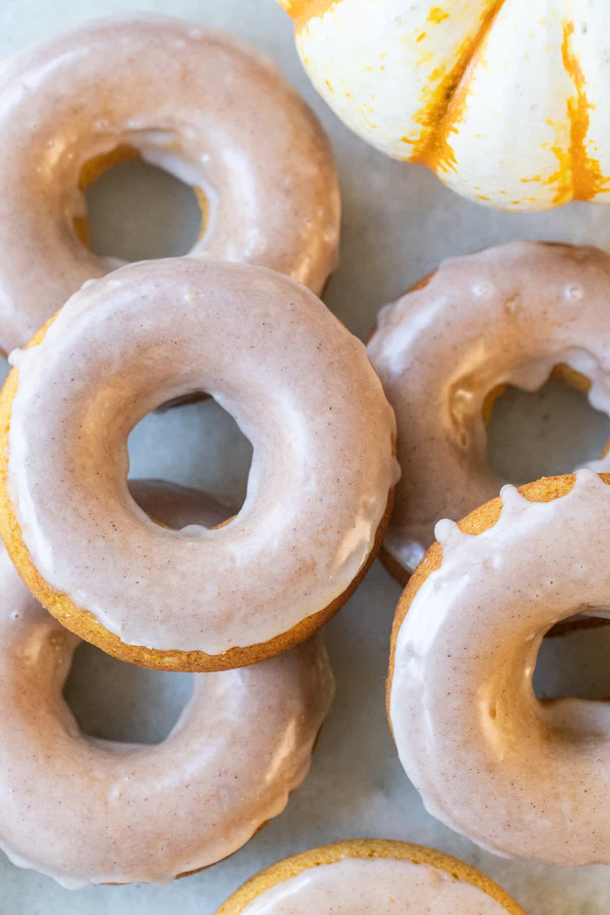 Baked pumpkin donuts with glaze.