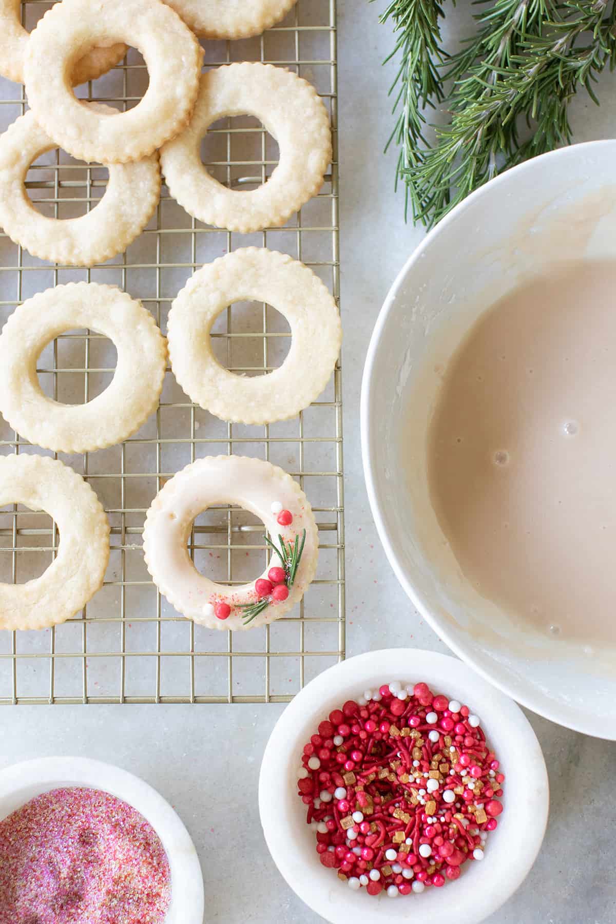 Wreath cookies with sprinkles and vanilla glaze.