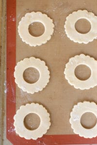 Wreath cookies lined on a Silpat.