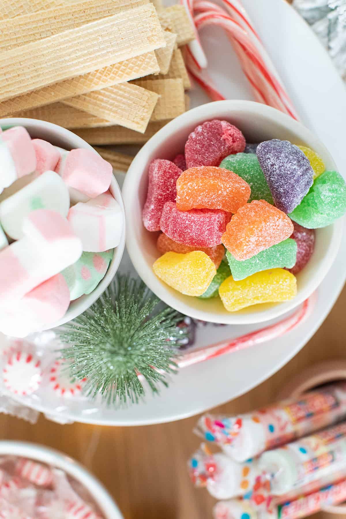 Candy in bowls for gingerbread house party.