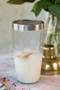 cocktail shaker filled with vodka, white chocolate and vanilla.