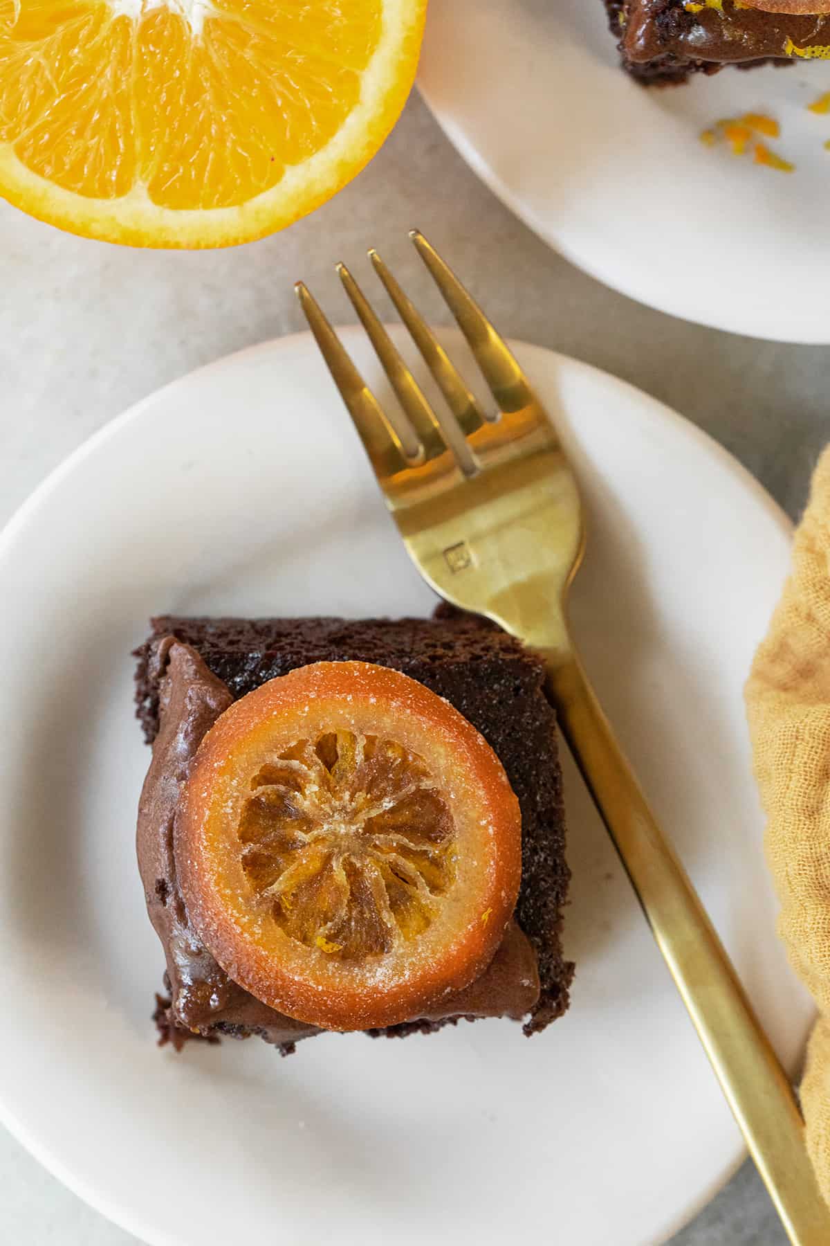 Slice of chocolate cake with orange.