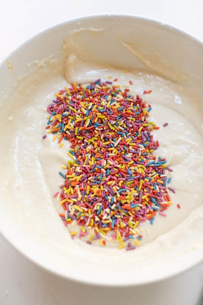 Sprinkles in cake batter to make funfetti cake.