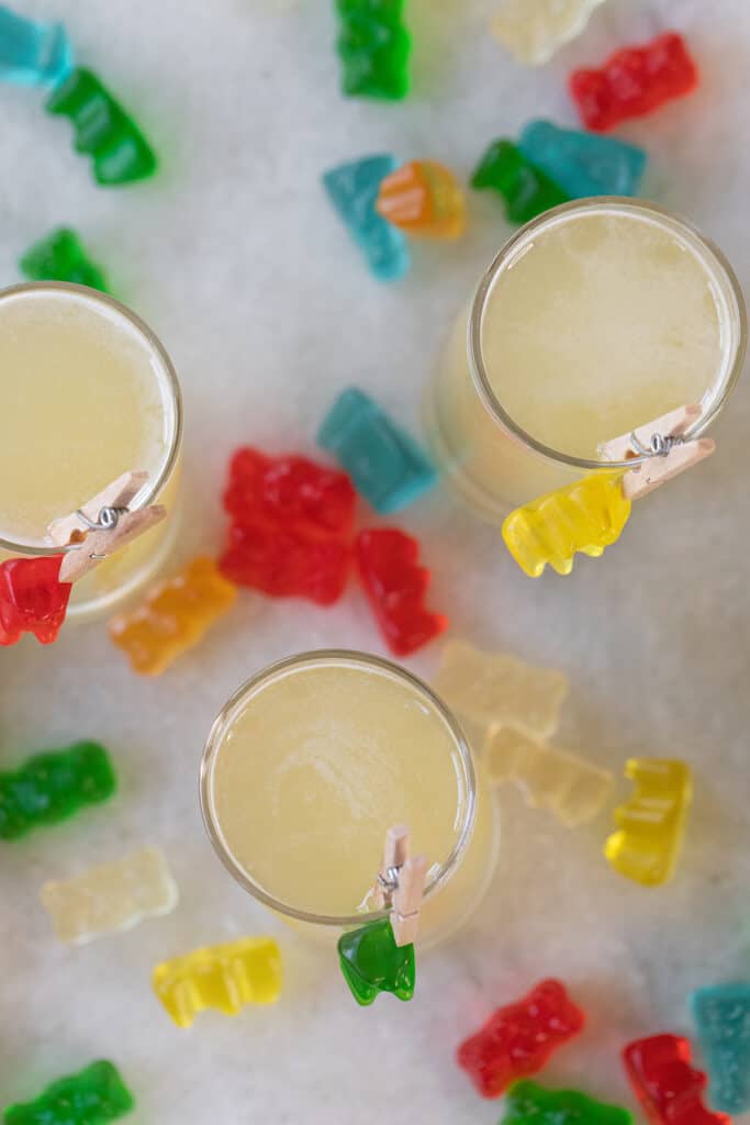 Colorful gummy bear shots lined up with candy garnish

