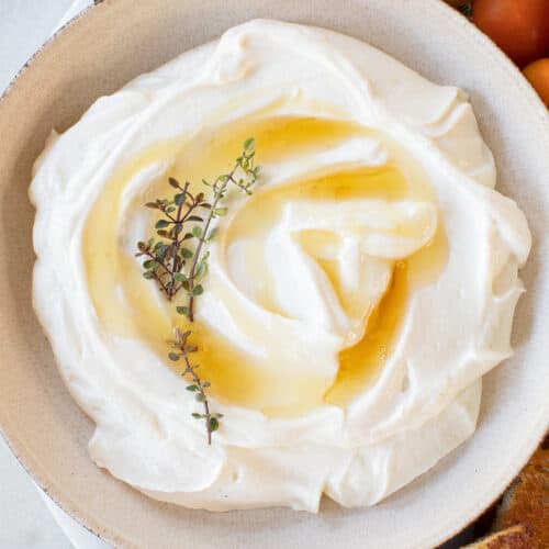 Creamy whipped ricotta with honey drizzled over the top,