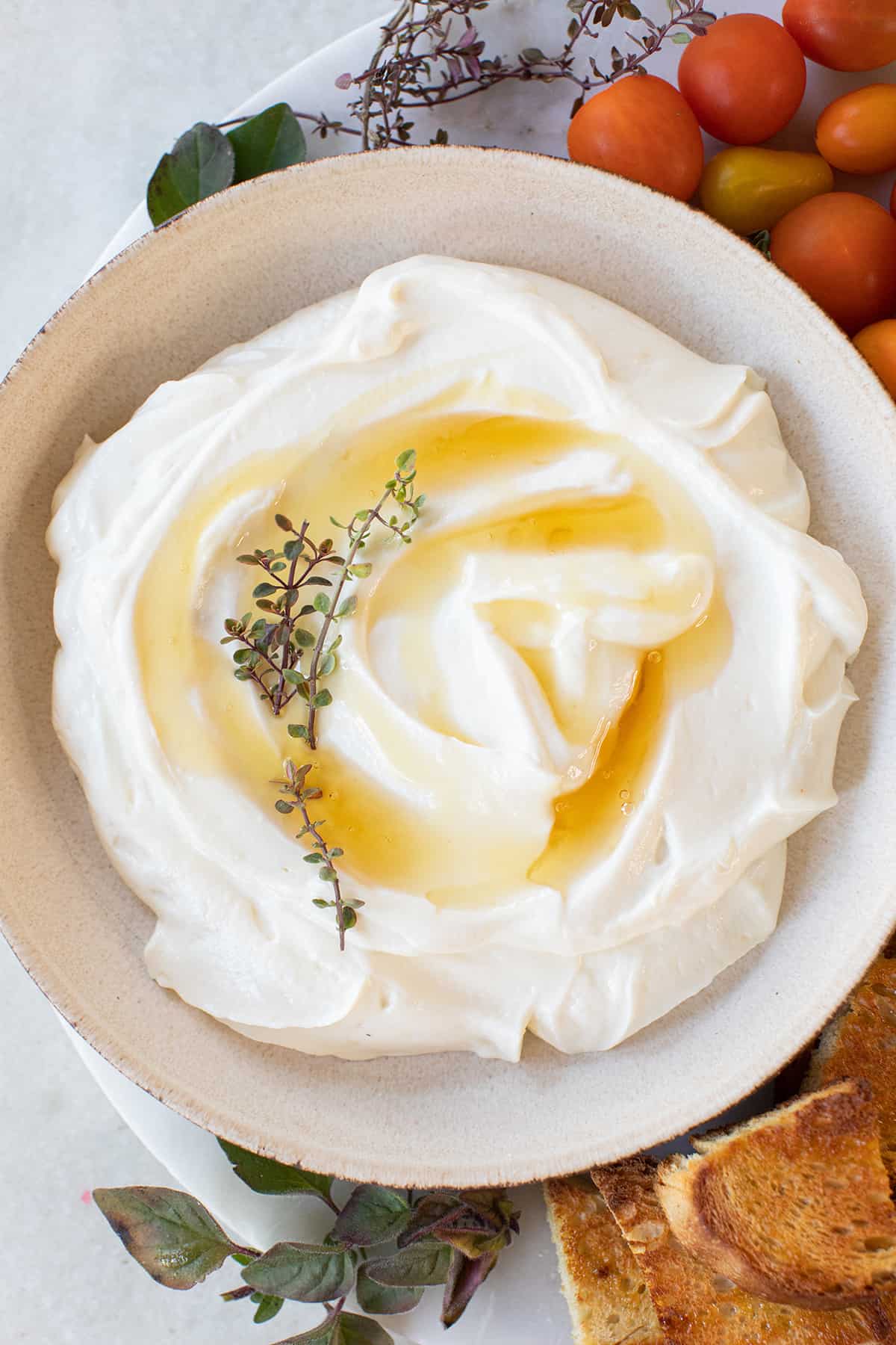 Creamy whipped ricotta with honey drizzled over the top,