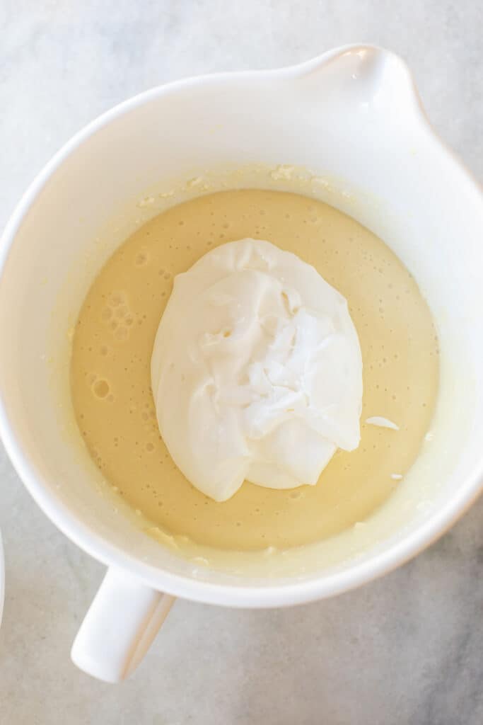 Whipped cream folded into vanilla pudding filling.