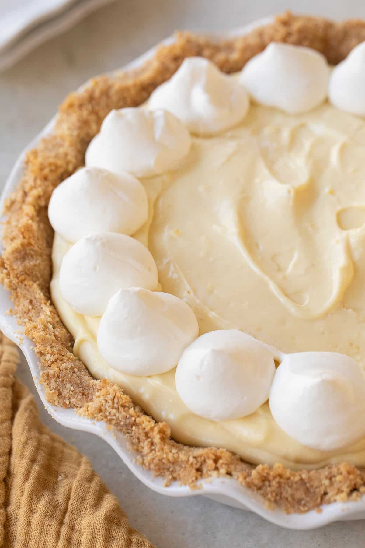 Banana cream pie recipe with whipped cream dollops. 