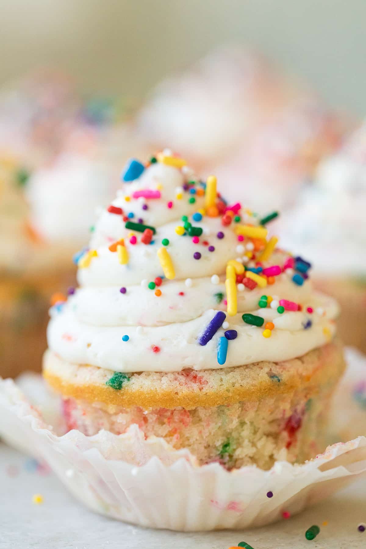 A homemade confetti cupcake with sprinkles.