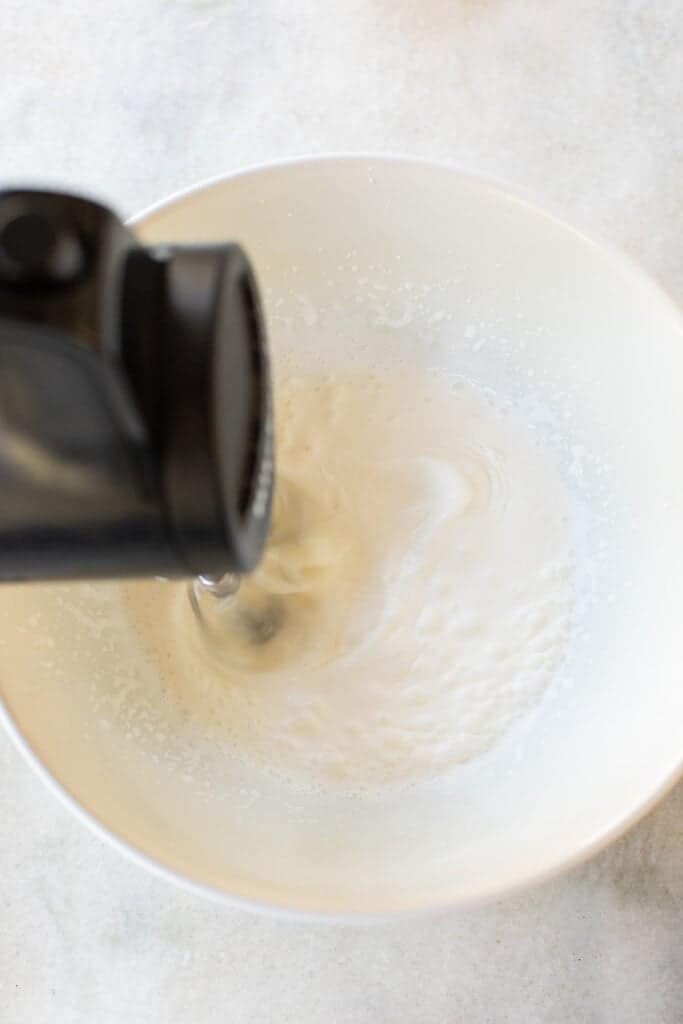 Whipping heavy cream for banana pudding pie filling.
