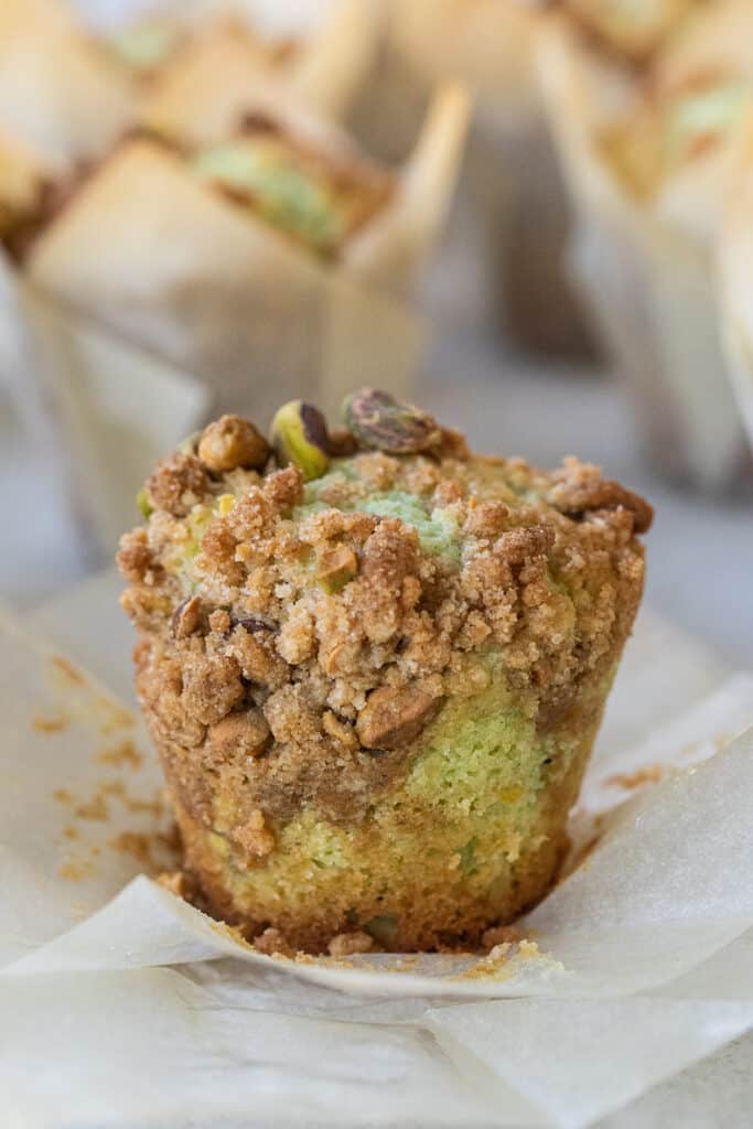 Pistachio muffin with crumble top.