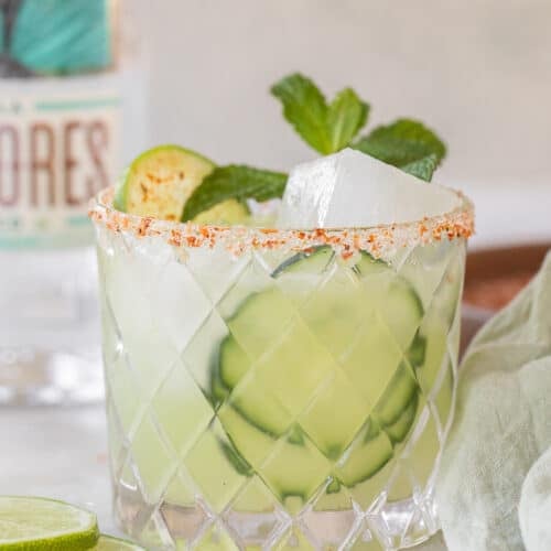 Cucumber margarita with cucumber slices and fresh mint.