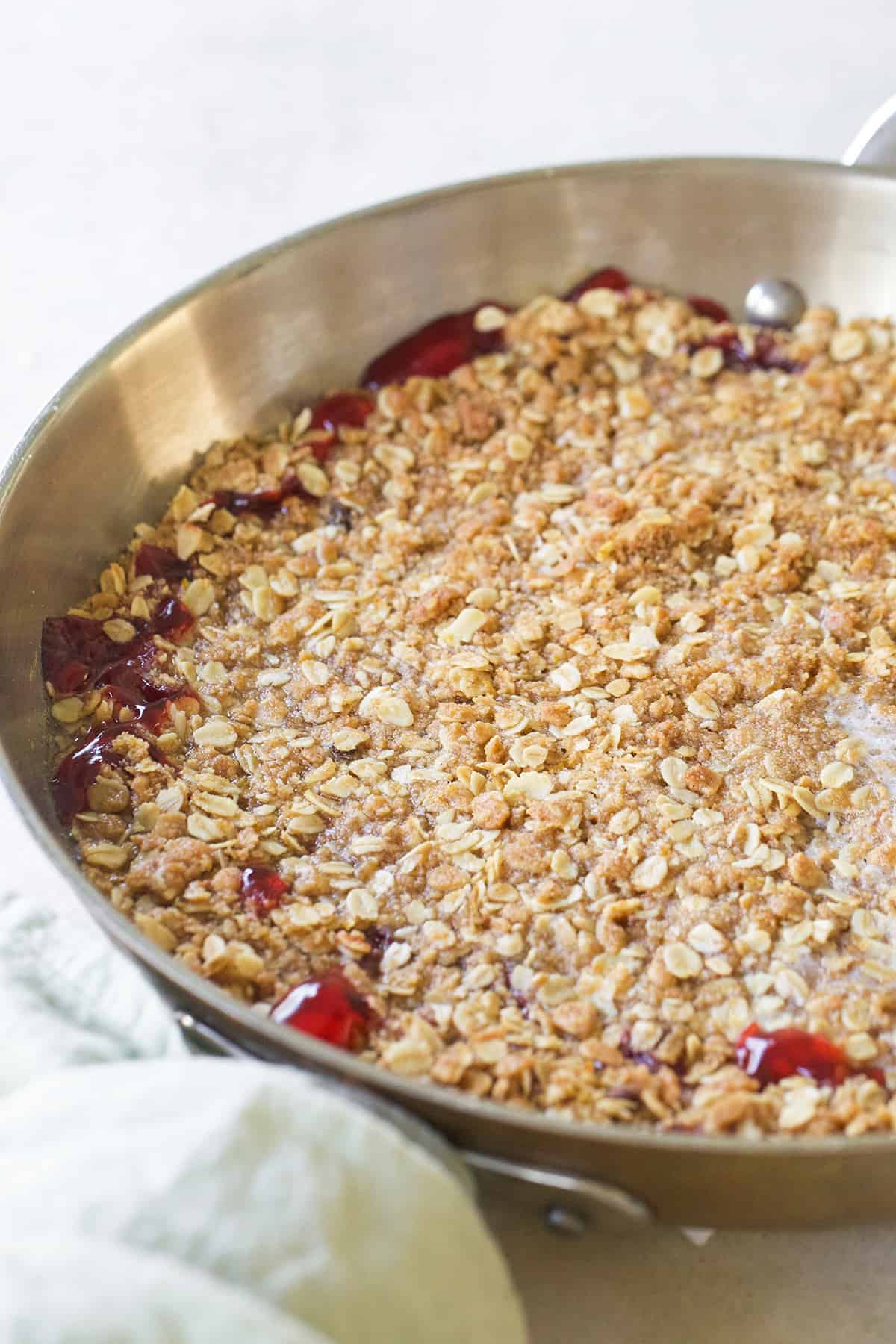 Recipe cherry crisp baked in a skillet. 