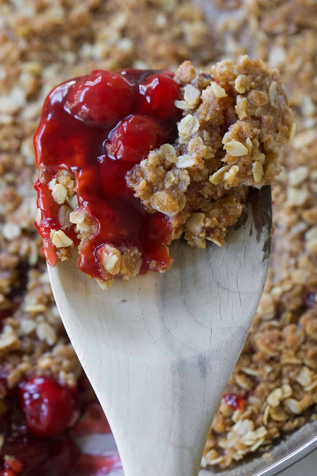 A spoon filled with cherry crsip.