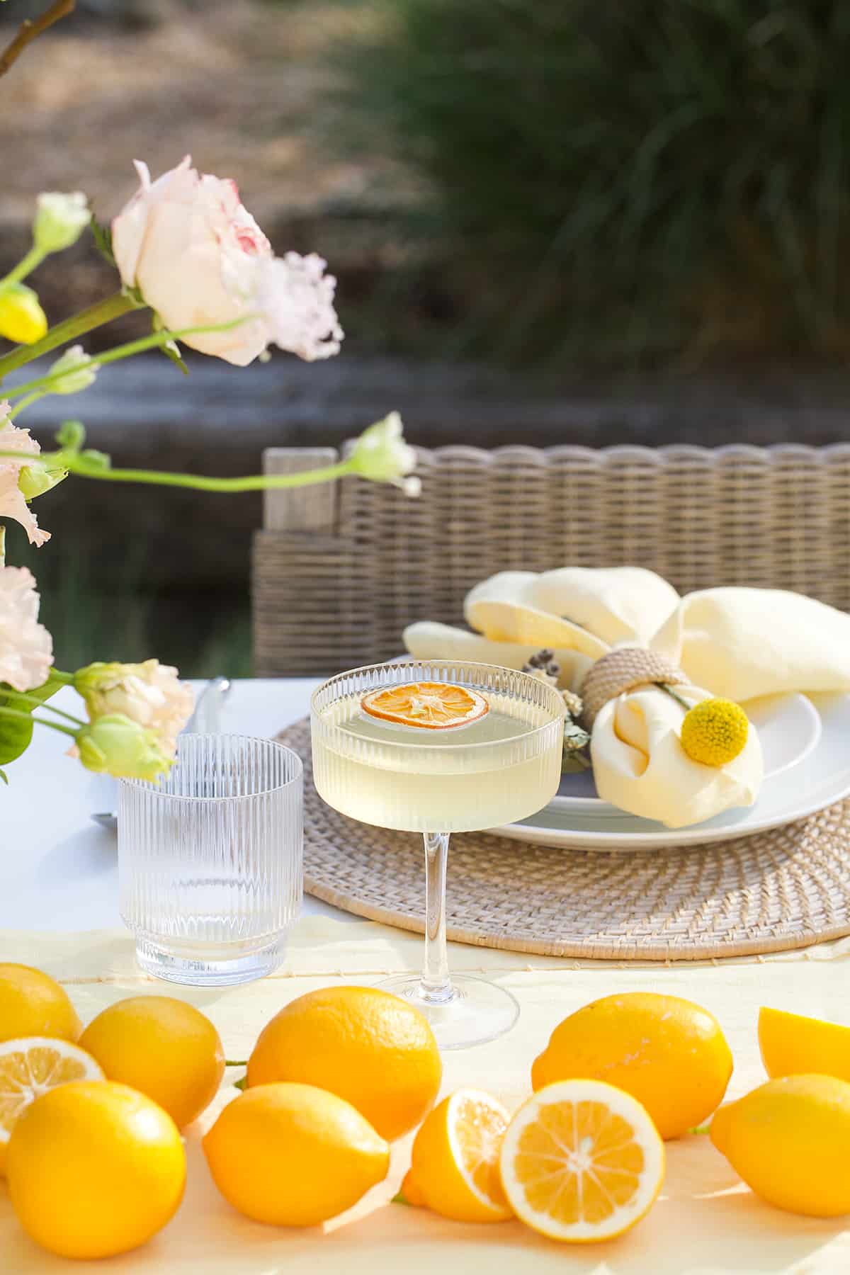 Lemon cocktail with Prosecco and limoncello on a table with fresh lemons.