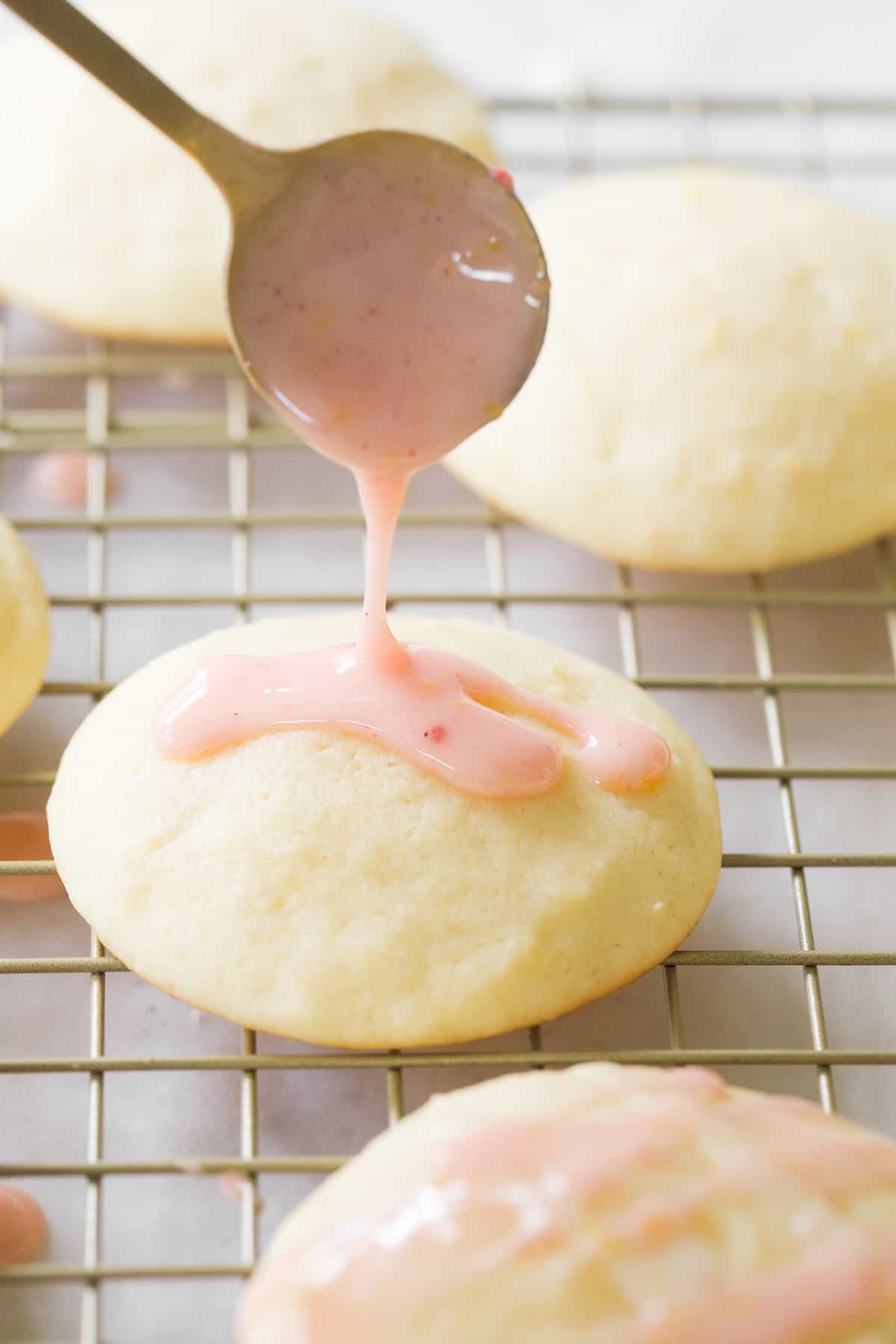 Strawberry lemon glaze drizzled over a lemon cookie. 
