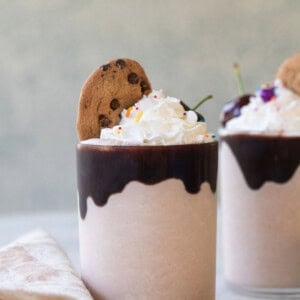 Chips Ahoy milkshake recipe with chocolate sauce and whipped cream.