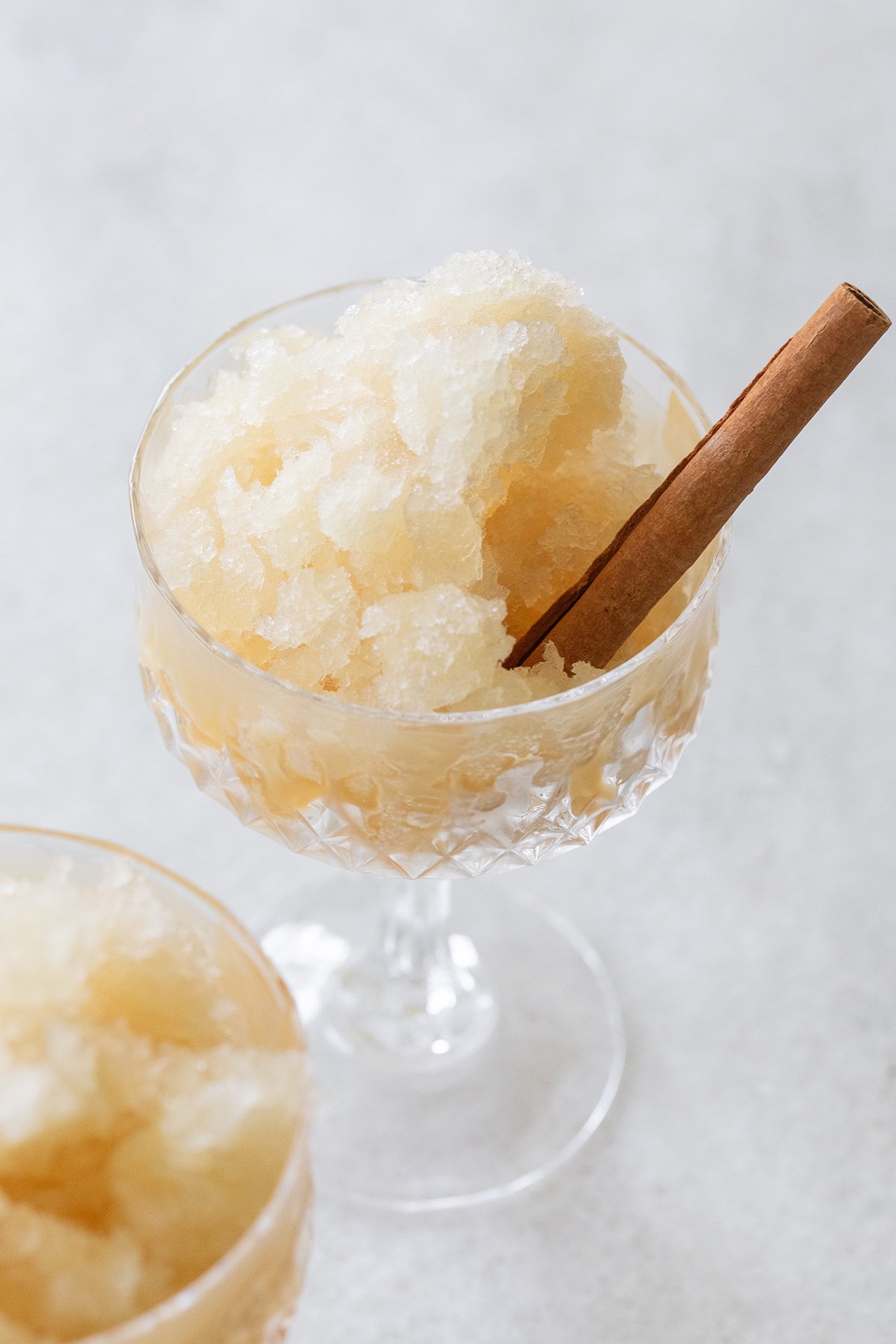 Frozen apple cider slushie with cinnamon stick. 