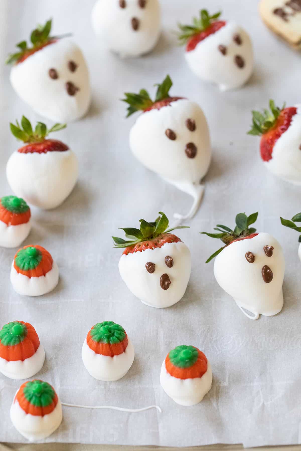 Strawberries and pumpkins dipped in white chocolate. 