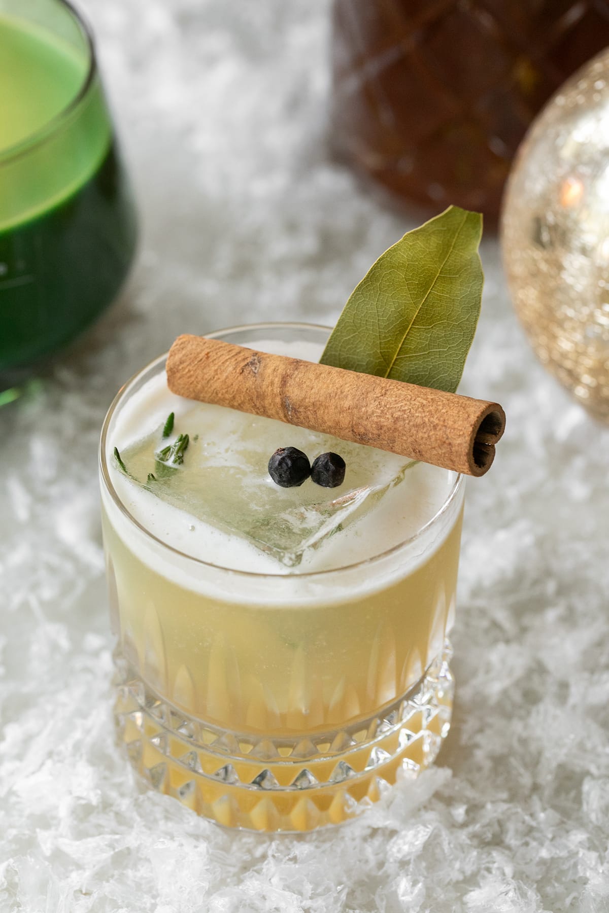 Whiskey sour made with a homemade honey syrup with herbs and spices. 