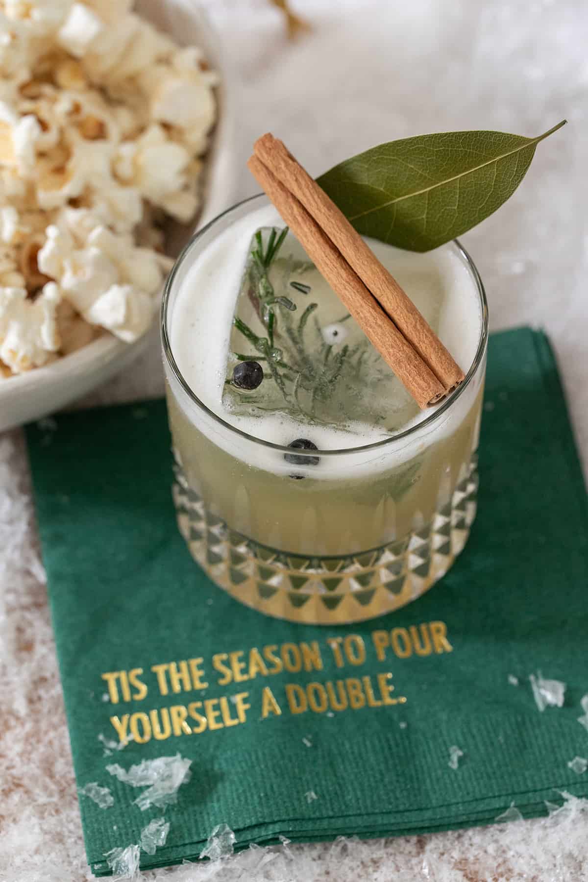 Whiskey sour cocktail recipe with rosemary and spices.