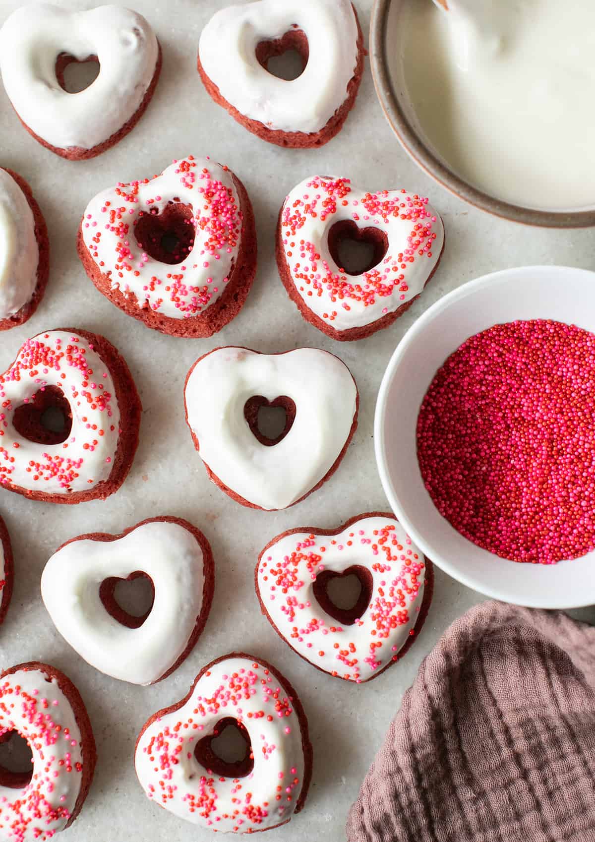 Baked red velvet donuts with cream cheese glaze.