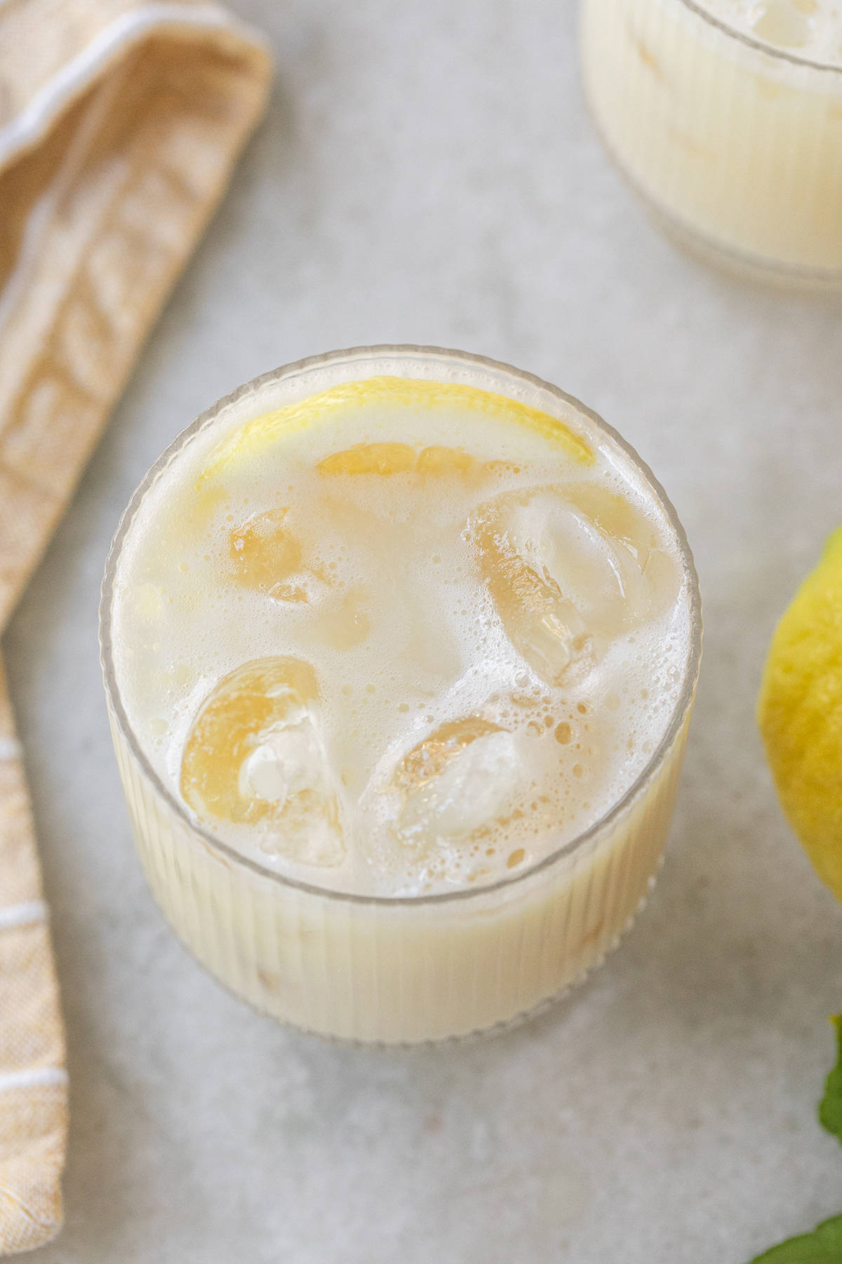 Creamy lemonade with lemon slice.