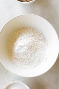 All-purpose flour, baking soda, baking powder and salt in a bowl.