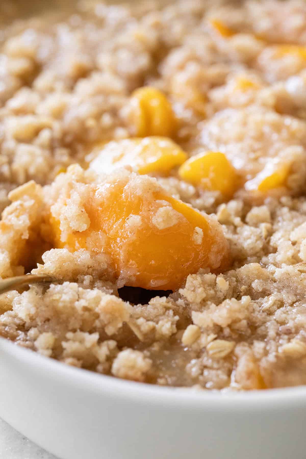 Peach crisp made with canned peaches.