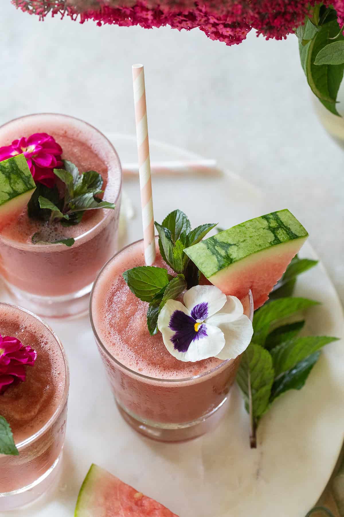 Watermelon frosé recipe with cocktail garnishes. 