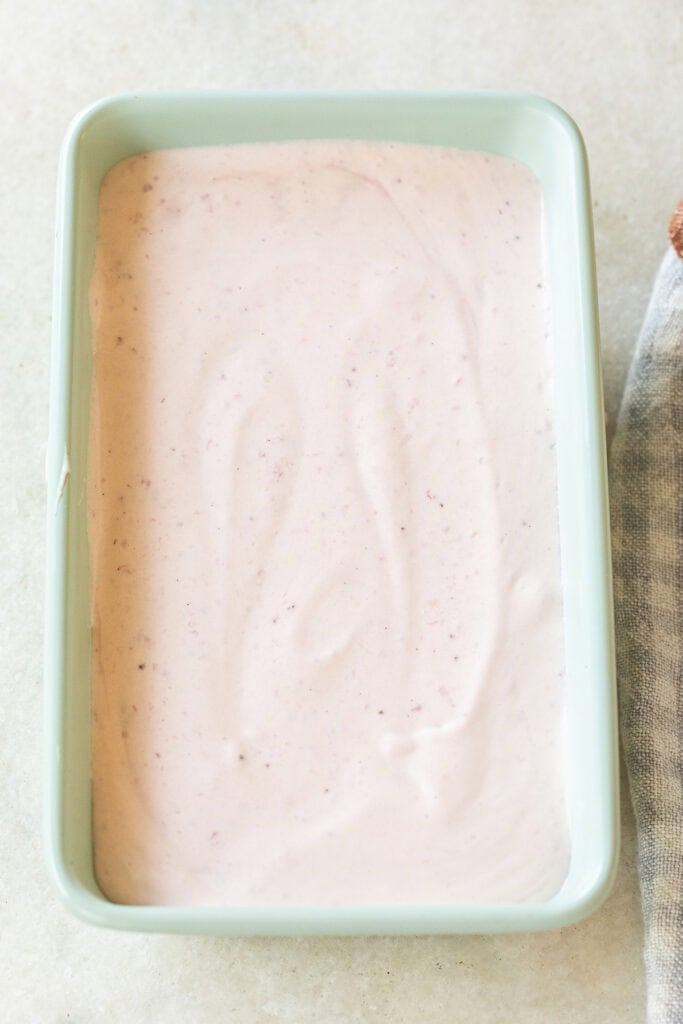 Strawberry ice cream in a freezer-safe container.