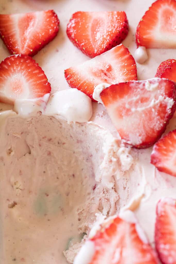 Strawberry ice cream recipe with a scoop taken out.