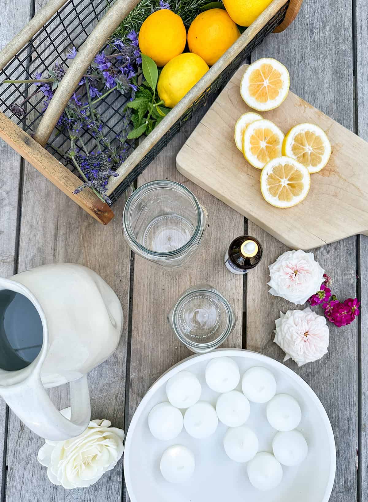 Citronella oil, candles, lemon slices, herbs and flowers. 