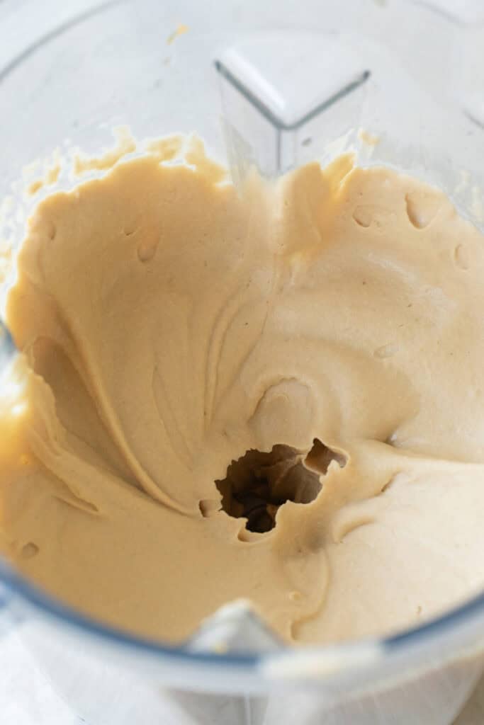 Blending hummus in a powerful blender.
