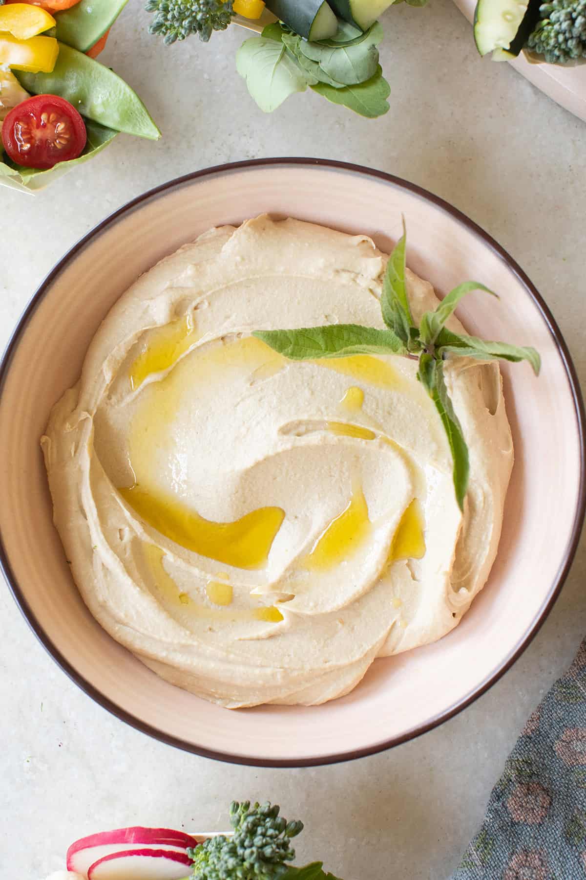 Creamy homemade hummus with olive oil.