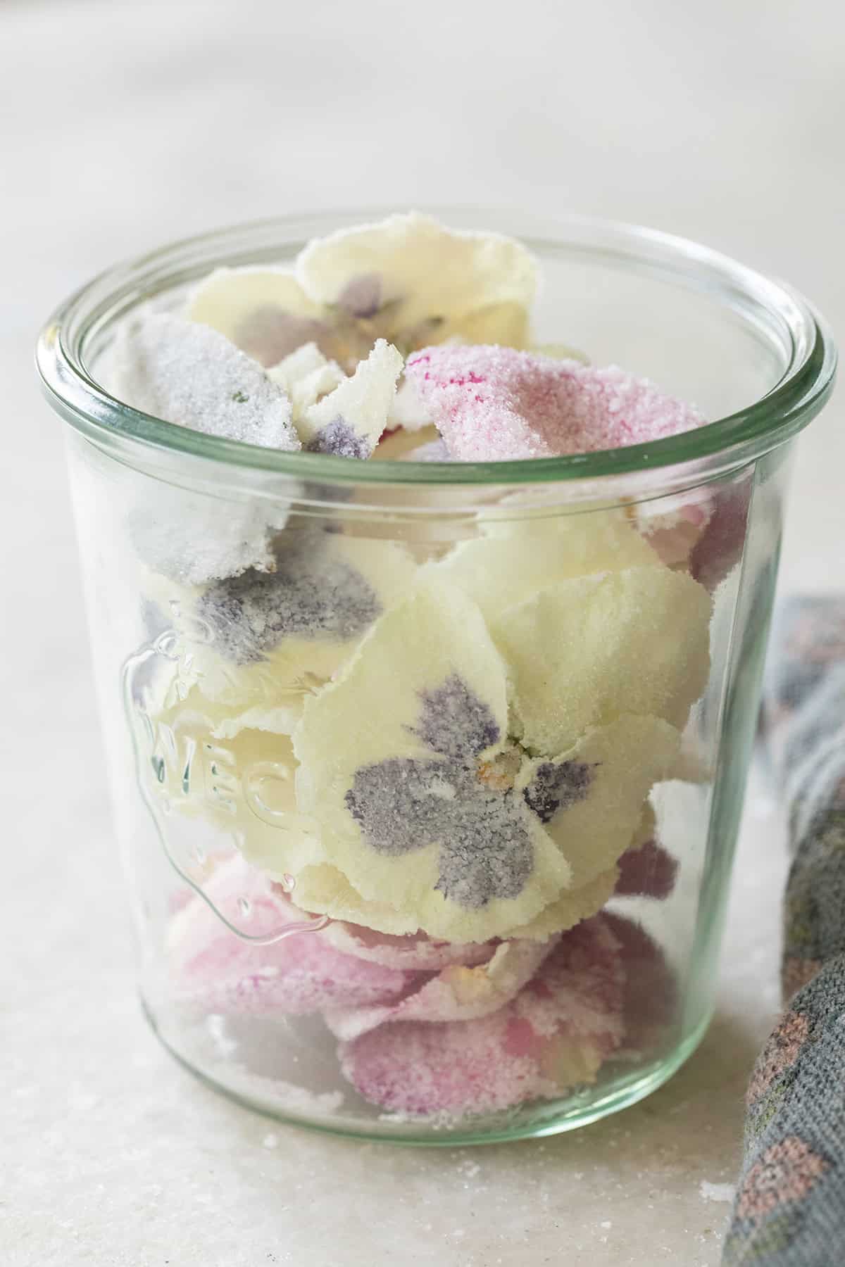 Jar filled with candied flowers.