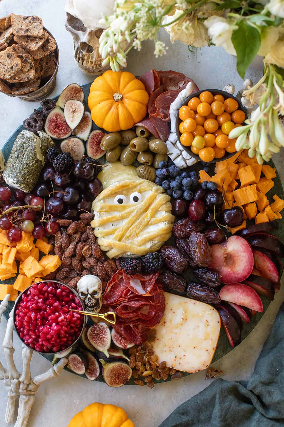 Halloween cheese platter with mummy brie.