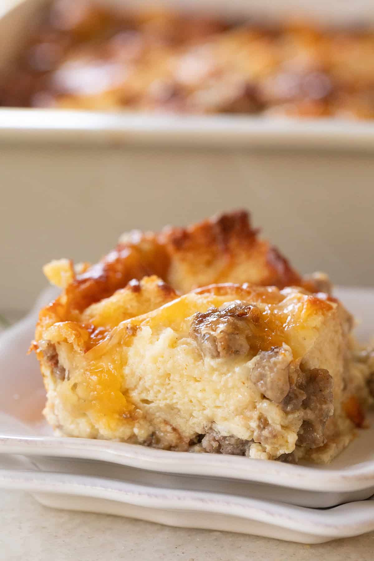 Slice of breakfast casserole with sausage and cheese.