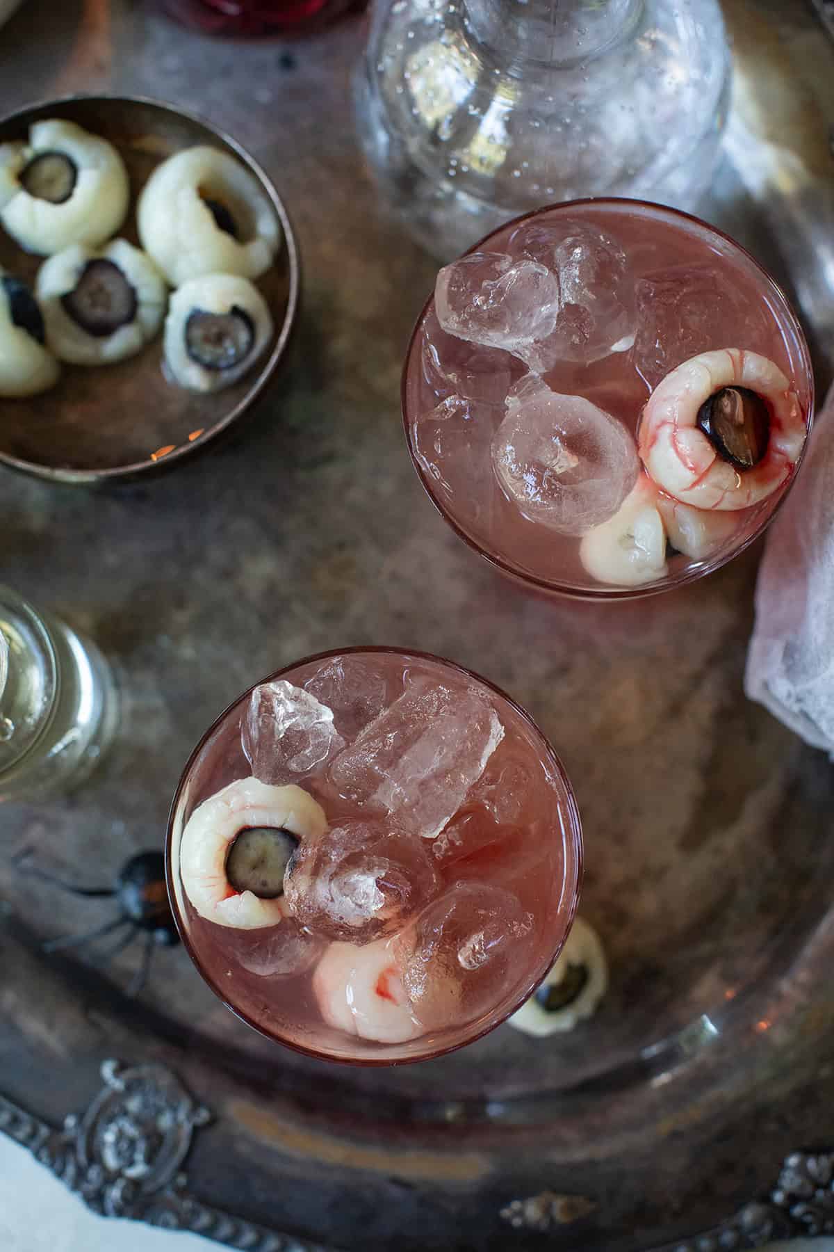 Halloween cocktail that looks red with eyeballs.