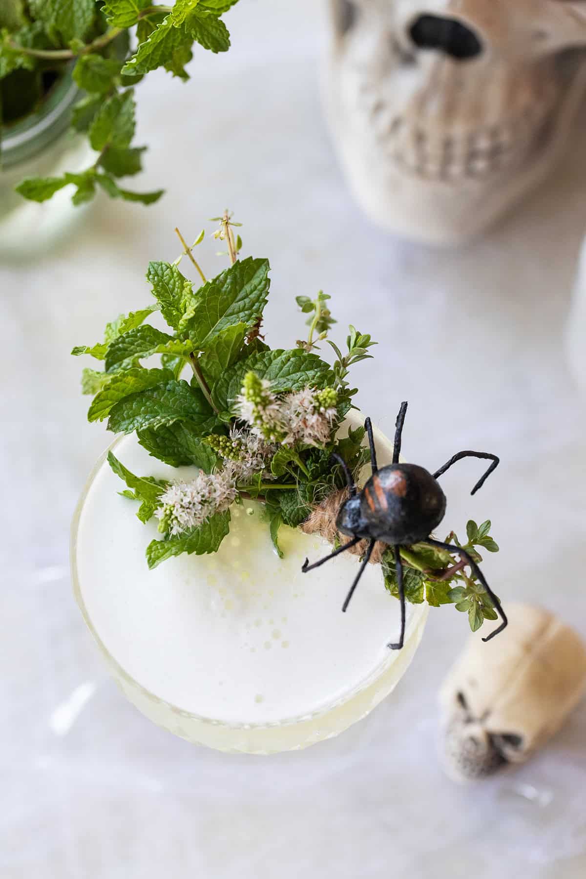 Sake sour cocktail with Halloween garnishes to make it spooky.