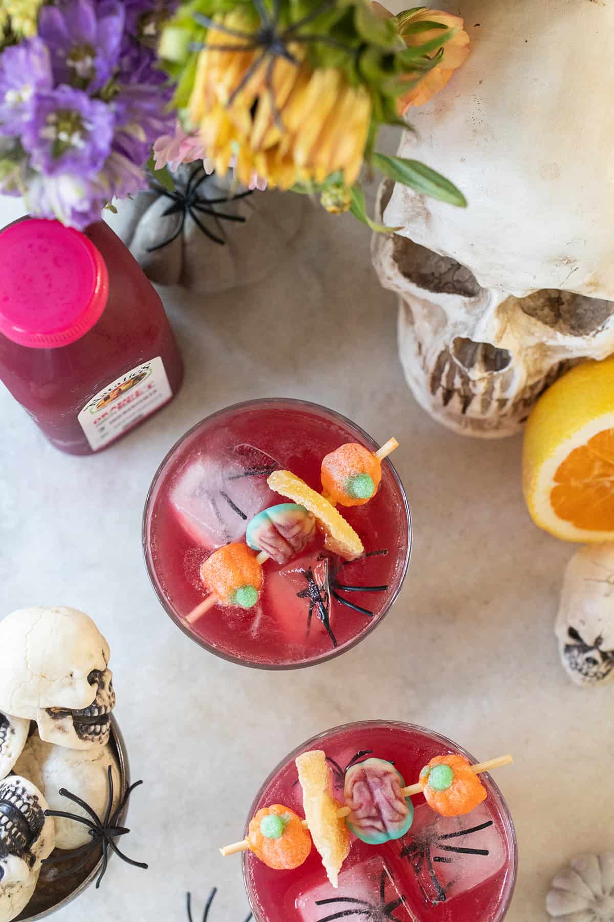 A festive Halloween mocktail recipe with candy skewers.