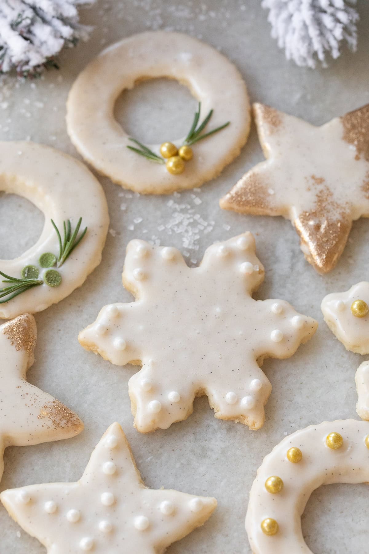 Cutout shortbread cookies decorated with sprinkles. 