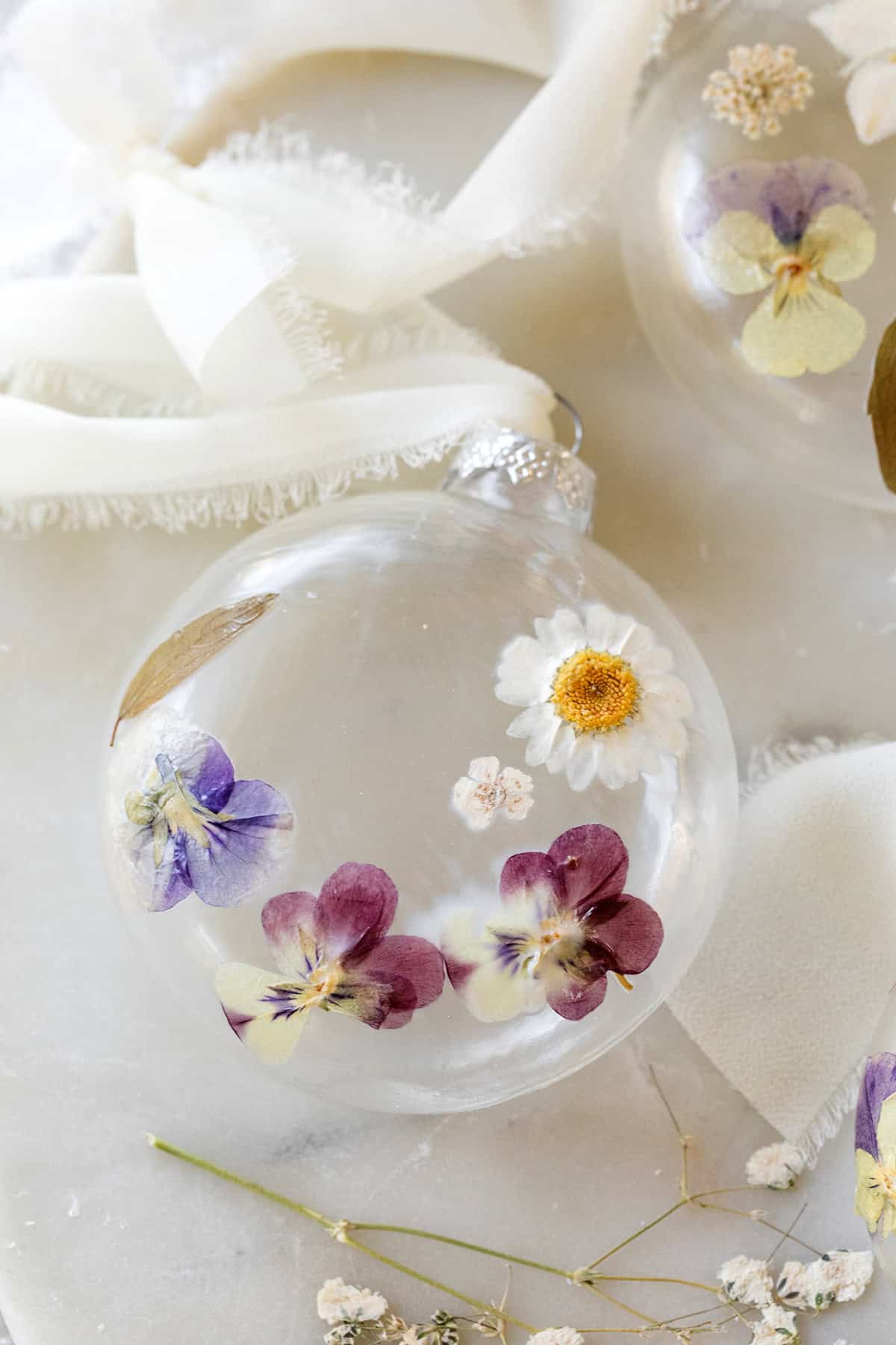 DIY Christmas ornament with dried pressed flowers.