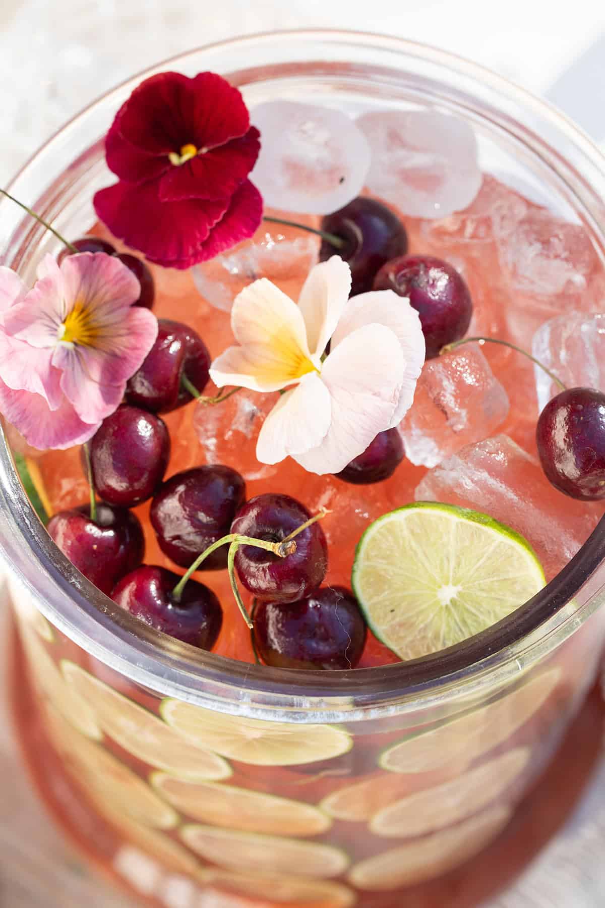 Easy punch recipe with cherry juice, lime juice, gin and tonic water.