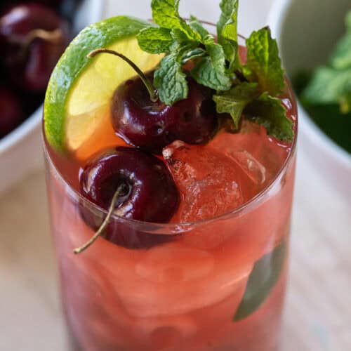 Cherry mojito recipe with fresh cherries and mint.